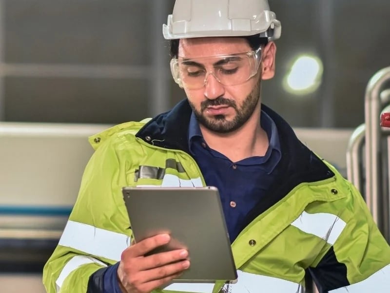 Employee reading data from tablet