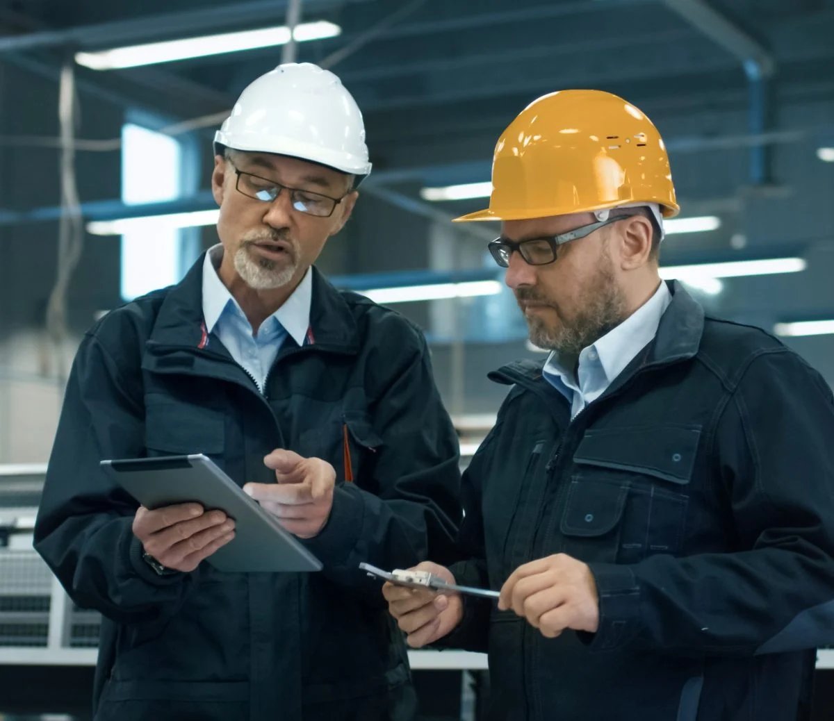 Engineers discussing data from tablet